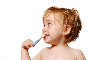 child brushing teeth